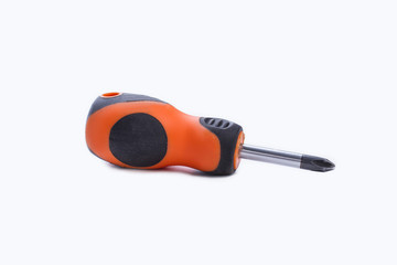 Manual screwdriver with rubber handle. Small screwdriver isolated on white background.