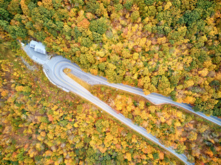 Scenic highway hairpin turn in autumn