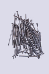 Nails isolated on white background. Metal tool for technician.