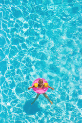 Aerial view of a little girl in the pool