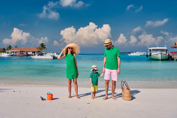 Family with three year old boy on beach