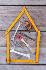 Different carpenter tools on wooden background. Composition with costruction tools on wooden...