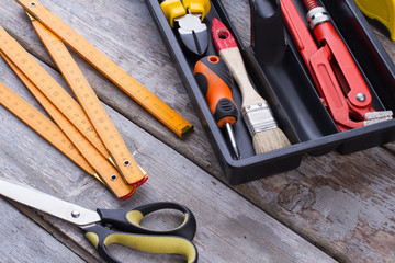 Carpenter tools on wooden background. Various construction tools for repair.