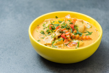 Fresh tasty soup with Asian curry and spices. Beautiful yellow soup dishes with fresh vegetables. Buffet of Assorted of Chinese Food Dishes.