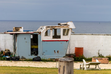 Fototapeta na wymiar fishing boat cabin on the ground