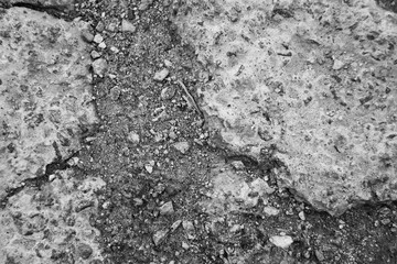 Monochrome broken road with gravel