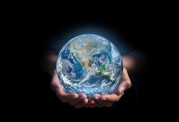 earth in hands. green planet on hand. save of earth. environment concept for background web or world guardian organization.Elements of this image furnished by NASA © chathuporn