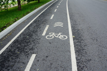 Fototapeta premium asphalt bicycle track with a bicycle marking