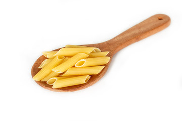 dry pasta penne Italian food in a spoon on white background.