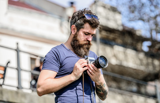 nice shot. retro photographic equipment. hipster man in summer sunglasses. photo of nature. reporter or journalist. Mature hipster with beard. Bearded man. brutal photographer with camera - Powered by Adobe