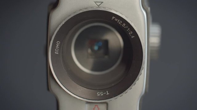 Close-up shot of the objective of videocamera and its lens inside.