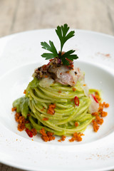 Green seafood spaghetti