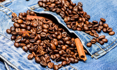 Coffee shop or store. Texture and background concept. Fresh roasted coffee close up. Beans and spices in jeans pocket. Degree of roasting coffee beans. Coffee for inspiration and energy charge