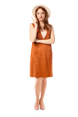 Portrait of mature woman with raised index finger on white background