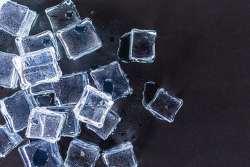 group ice cubes on black background.