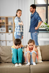 family problem, conflict and people concept - sad children closing ears while their parents...