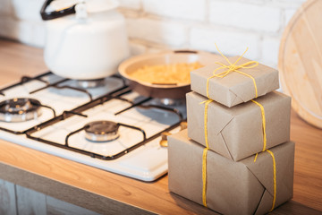 Homemade bakery food delivery. Rustic paper handmade gift boxes tied with yellow cord.