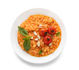 Plate with tasty risotto on white background