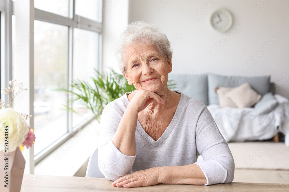 Poster Portrait of senior woman at home