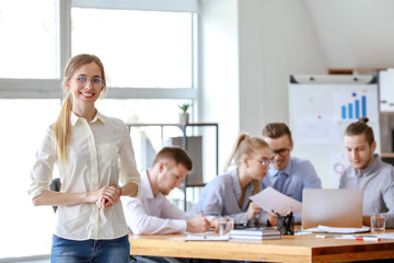 Young businesswoman at meeting in office