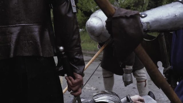Footage of the medieval battlefield with dead soldiers in armor