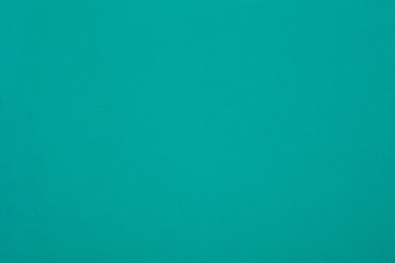 Jade green felt texture abstract art background. Colored construction paper surface. Empty space.