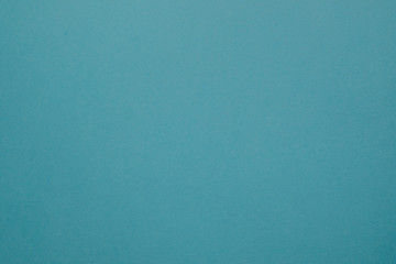 Pale cyan blue felt texture abstract art background. Colored construction paper surface. Empty space.