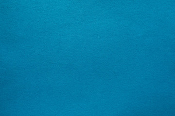 Light teal blue felt texture abstract art background. Solid color wool textile. Copy space.