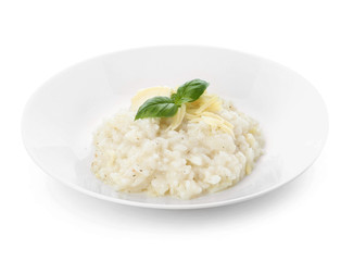 Plate with tasty risotto on white background