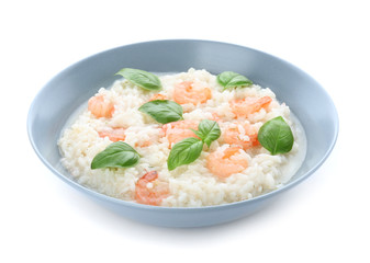 Plate with tasty risotto on white background