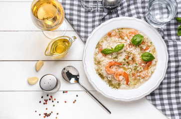 Plate with tasty risotto on table