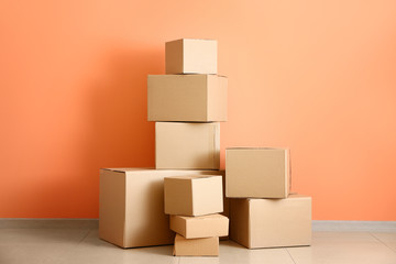 Cardboard boxes near color wall