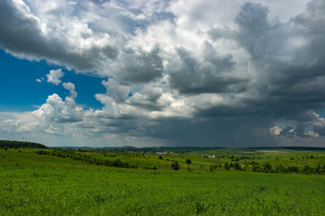 Summer thunderstorm over the village