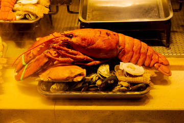 Fresh cooked seafood dishes with clam, crayfish, lobster , crab in the kitchen of China, Xiamen