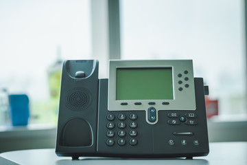 Close up soft focus on ip phone devices at office desk