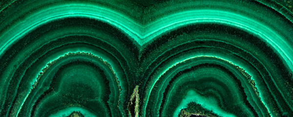The green malachite. An ornamental stone. Photo texture. Macro.