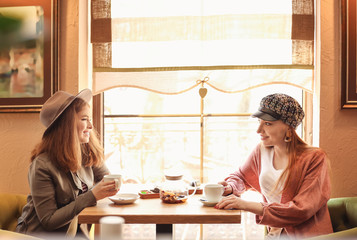 Beautiful young women resting in cafe