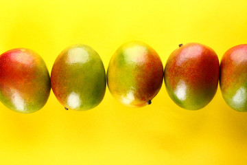 Tasty fresh mango on color background