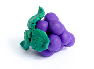 elicious grapes clay plasticine on white background,cute fruit dough,Select focus.