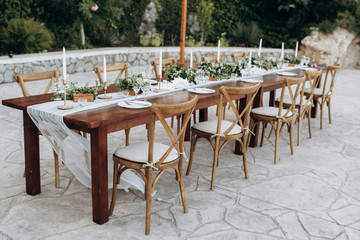 Fototapeta na wymiar Eco-friendly, wedding decor. Wooden table newlyweds for a party.