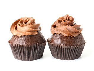 Tasty chocolate cupcakes on white background