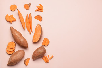 Fresh sweet potatoes on light background