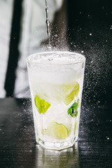 Close-up of Mojito cocktail stands on a bar counter