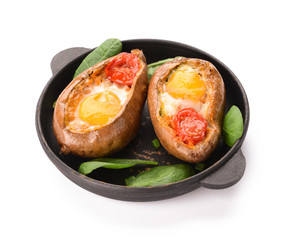 Baked sweet potato with egg and tomato on white background