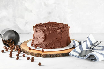 Tasty chocolate cake on light table