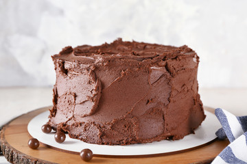 Tasty chocolate cake on light table