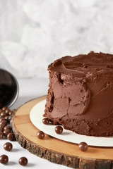 Tasty chocolate cake on light table