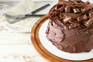 Tasty chocolate cake on table