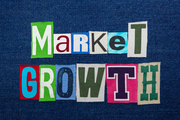 MARKET GROWTH text word collage, multi colored fabric on blue denim, expanding markets concept, horizontal aspect