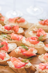 Smoked salmon bite sandwich with dill and cream cheese.